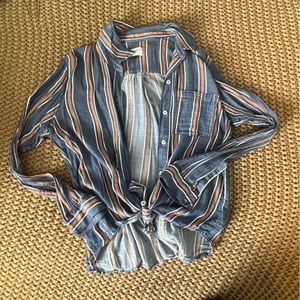 Casual button down shirt, worn tied in a cute knot in the front.